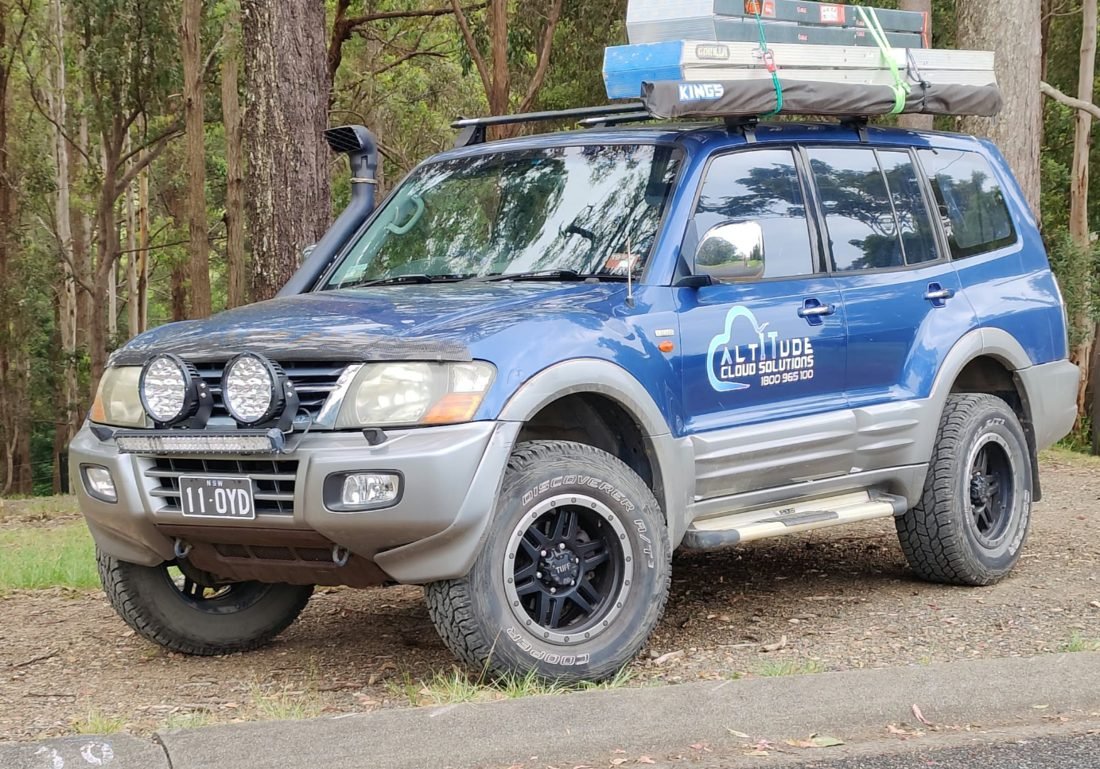 ACS branded four wheel drive loaded with ladders for rural jobs